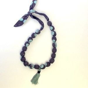 Fabric covered wooden bead necklace with tassel